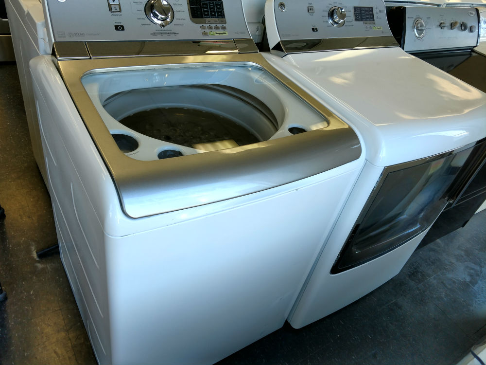 Used white top load washer dryer