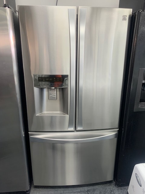 French door refrigerator with water and ice dispenser
